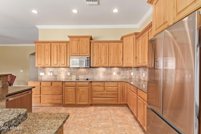 kitchen featuring tasteful backsplash, light stone countertops, stainless steel appliances, crown molding, and recessed lighting