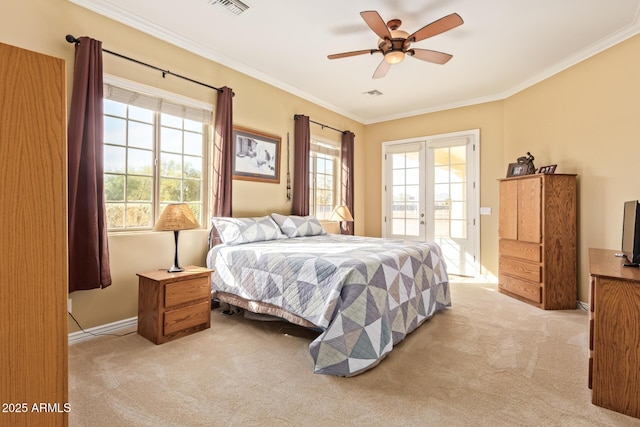 bedroom featuring light carpet, a ceiling fan, ornamental molding, access to exterior, and french doors