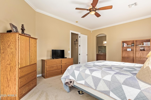 bedroom featuring arched walkways, light carpet, crown molding, and visible vents