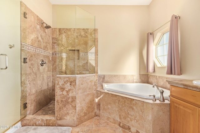 full bathroom with a stall shower, vanity, and a bath