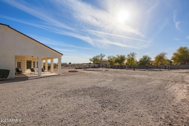 view of yard featuring a patio area and fence