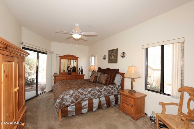 carpeted bedroom with ceiling fan and access to exterior