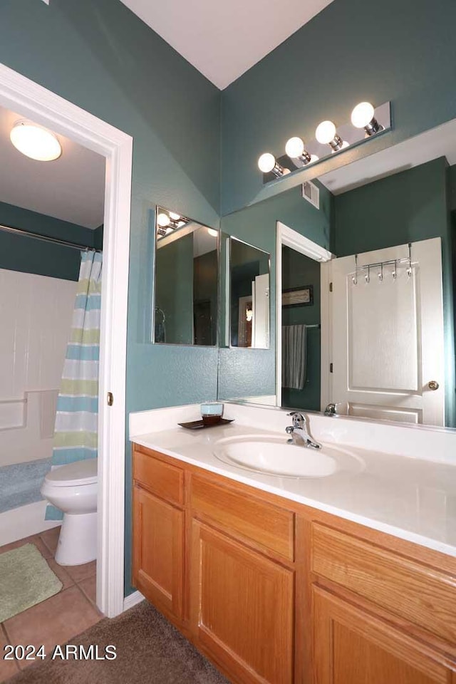 bathroom with vanity, tile flooring, and toilet