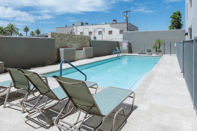 view of swimming pool featuring a patio area