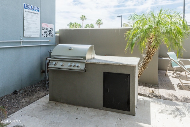 view of patio featuring a grill and an outdoor kitchen