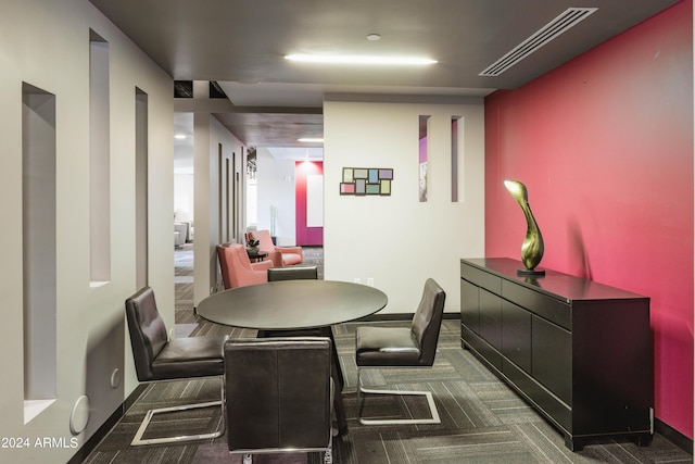 view of carpeted dining area