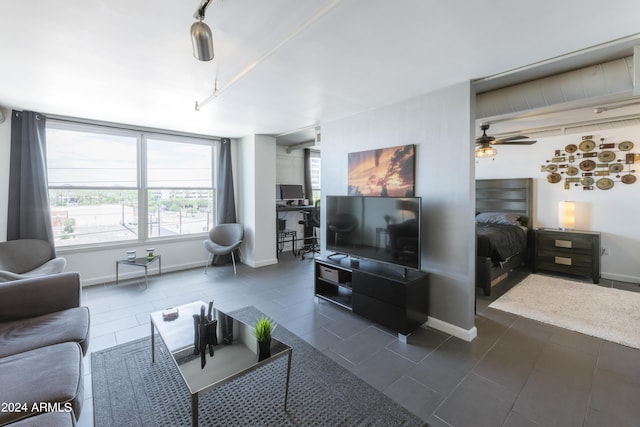 tiled living room with ceiling fan