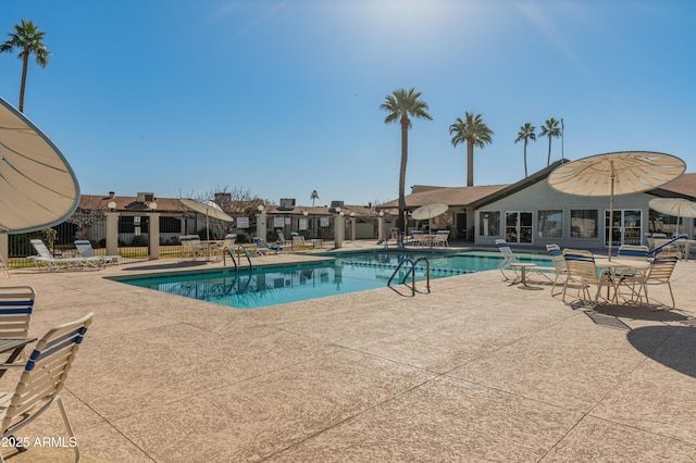 view of swimming pool featuring a patio