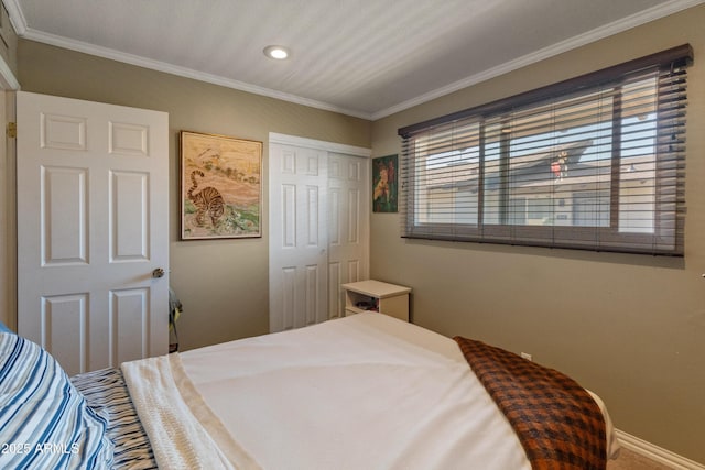 bedroom featuring a closet, ornamental molding, and multiple windows