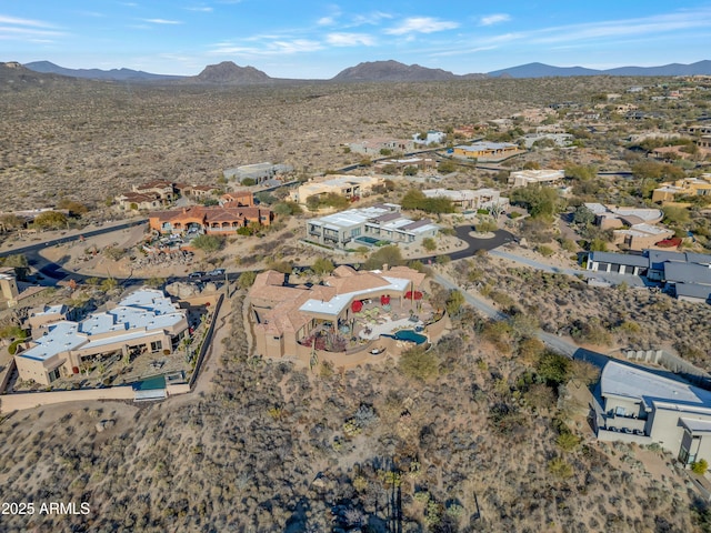 birds eye view of property with a mountain view