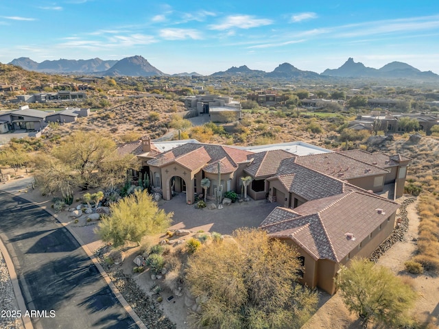 birds eye view of property with a mountain view