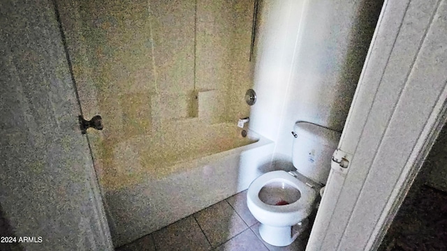 bathroom featuring tile patterned flooring and toilet