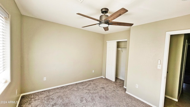 unfurnished bedroom with carpet flooring, ceiling fan, and a closet