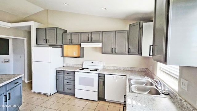 kitchen with gray cabinetry, white appliances, sink, lofted ceiling, and light tile patterned flooring