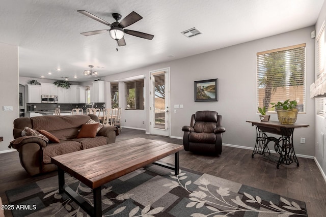 6862 W Honeysuckle Dr, Peoria, AZ 85383 - living room with a ceiling fan, baseboards, dark wood-style floors, and recessed lighting