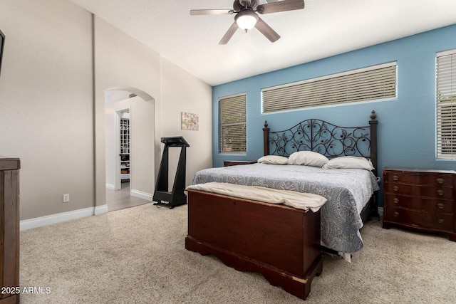 6862 W Honeysuckle Dr, Peoria, AZ 85383 - carpeted bedroom featuring arched walkways, baseboards, ceiling fan, and vaulted ceiling