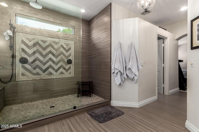 6862 W Honeysuckle Dr, Peoria, AZ 85383 - full bathroom featuring baseboards, walk in shower, a chandelier, and wood finished floors