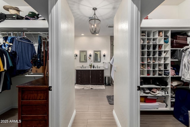 6862 W Honeysuckle Dr, Peoria, AZ 85383 - spacious closet featuring wood finished floors