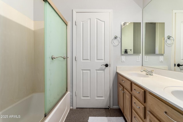 6862 W Honeysuckle Dr, Peoria, AZ 85383 - full bathroom with double vanity, tile patterned floors, and bath / shower combo with glass door