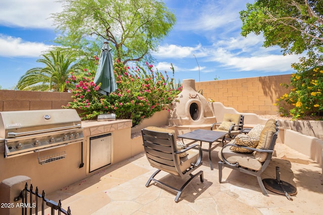 6862 W Honeysuckle Dr, Peoria, AZ 85383 - fenced backyard featuring a patio and an outdoor hangout area