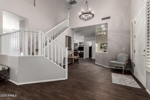 6862 W Honeysuckle Dr, Peoria, AZ 85383 - entrance foyer with a high ceiling, hardwood / wood-style floors, a chandelier, baseboards, and stairway