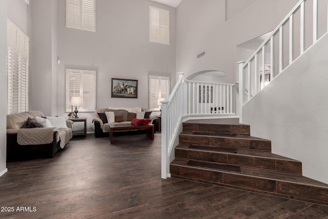 6862 W Honeysuckle Dr, Peoria, AZ 85383 - staircase featuring a towering ceiling and wood finished floors