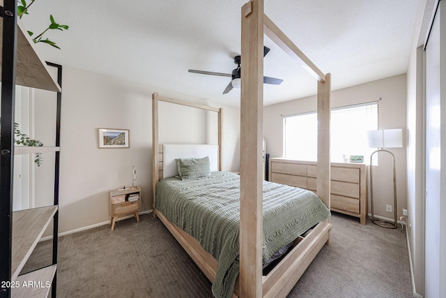 bedroom featuring a textured ceiling, ceiling fan, and carpet