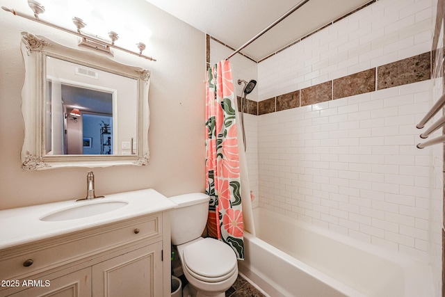 full bathroom featuring shower / bath combo, vanity, and toilet