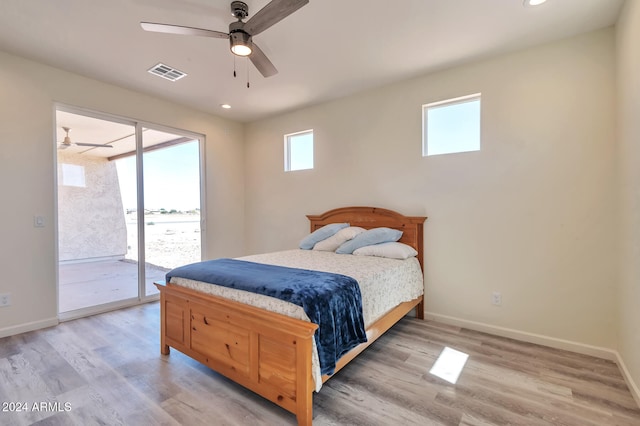 bedroom with ceiling fan, light hardwood / wood-style floors, and access to exterior