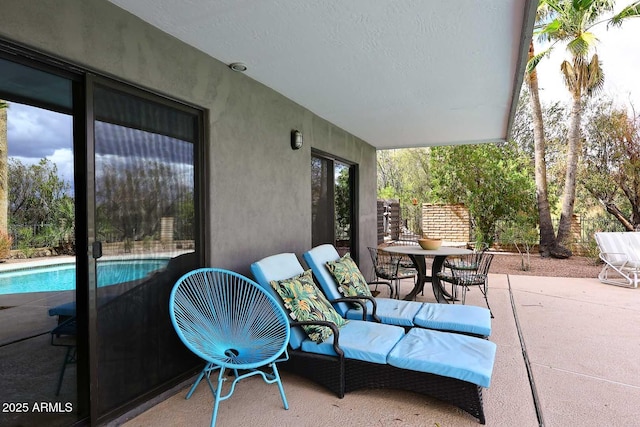 view of patio featuring an outdoor pool