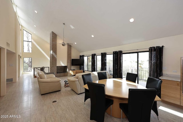 dining area with ceiling fan, high vaulted ceiling, and recessed lighting