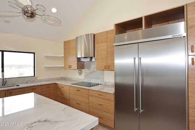 kitchen featuring black electric cooktop, vaulted ceiling, open shelves, a sink, and built in fridge