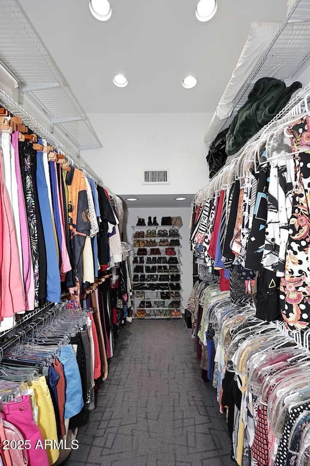 walk in closet with carpet floors and visible vents