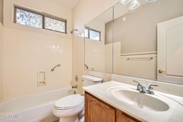 bathroom featuring shower / bath combination, vanity, and toilet