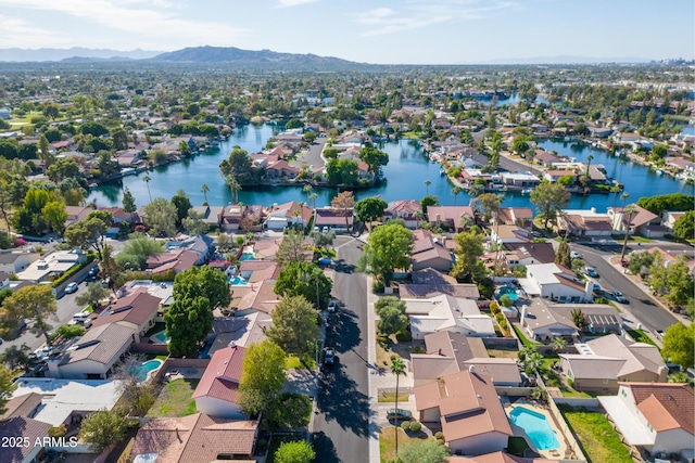 bird's eye view featuring a residential view and a water and mountain view