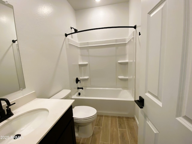 full bath featuring toilet, shower / bath combination, vanity, and wood finish floors