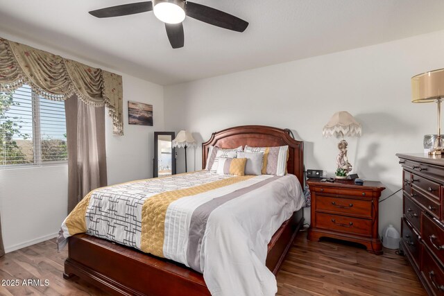 bedroom with ceiling fan and wood finished floors