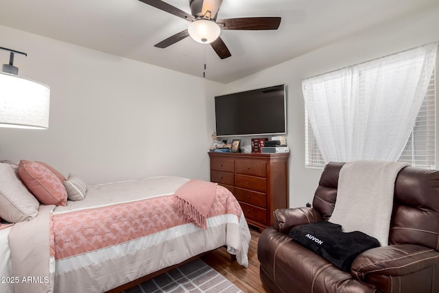 bedroom featuring wood finished floors and a ceiling fan