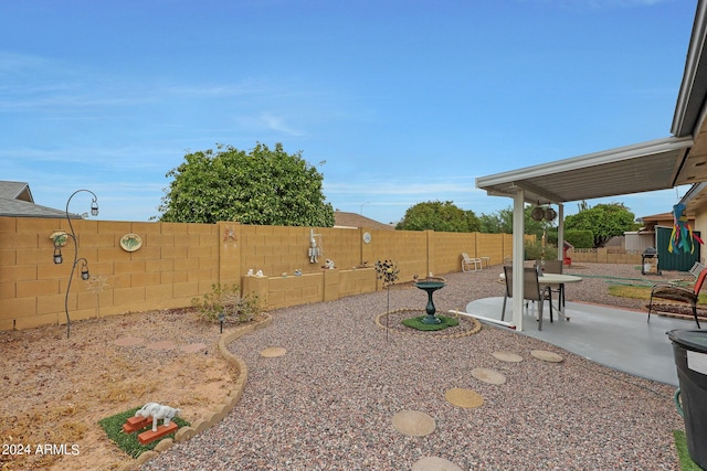 view of yard with a patio area and a fenced backyard