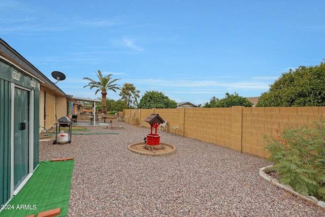 view of yard featuring a patio area and a fenced backyard