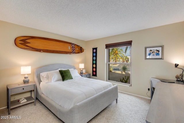 carpeted bedroom featuring a textured ceiling