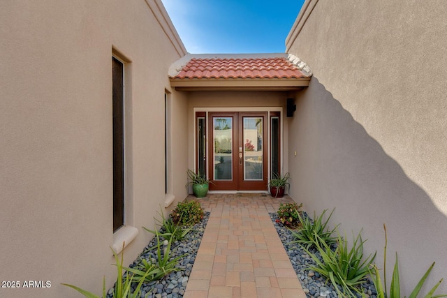 property entrance featuring french doors