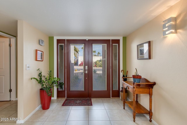 tiled entrance foyer featuring french doors