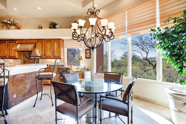 dining space featuring an inviting chandelier