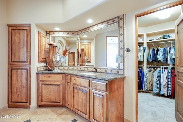 bathroom with tile patterned flooring and vanity