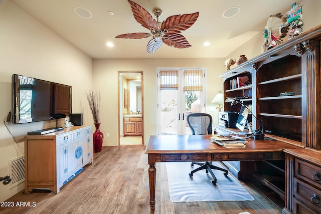 office space with ceiling fan and light hardwood / wood-style floors