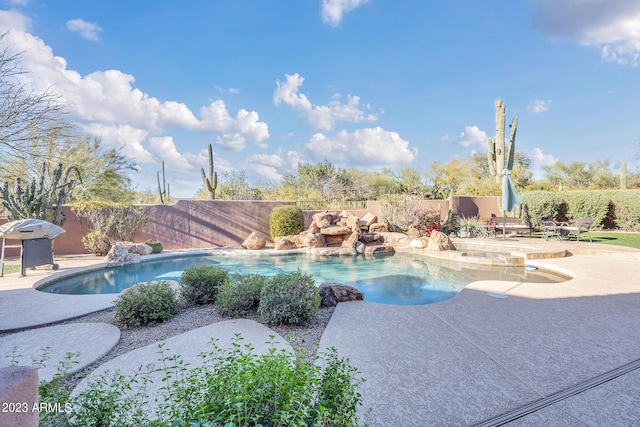 view of swimming pool featuring a patio area