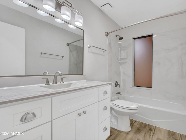 full bathroom featuring shower / bath combination, wood-type flooring, toilet, and vanity