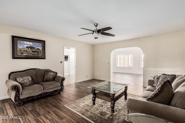 living room featuring dark hardwood / wood-style floors and ceiling fan