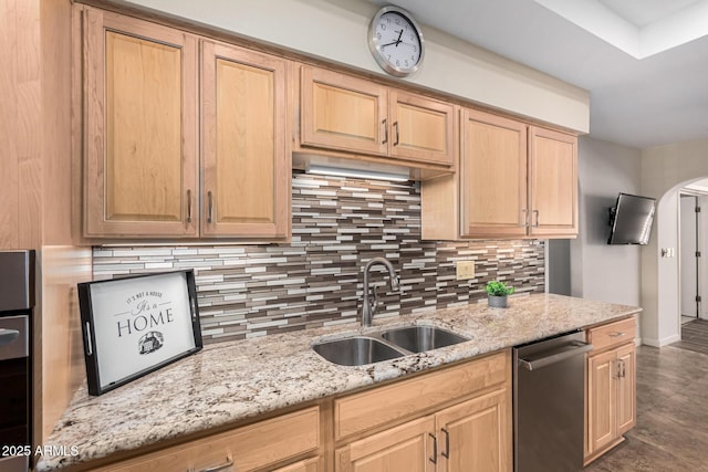 kitchen featuring sink, dishwasher, backsplash, light stone countertops, and light brown cabinets